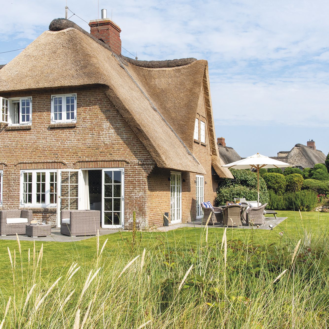 © A&M_Ferienhaus Kampen_Inselhaus Garten mit Dünengras